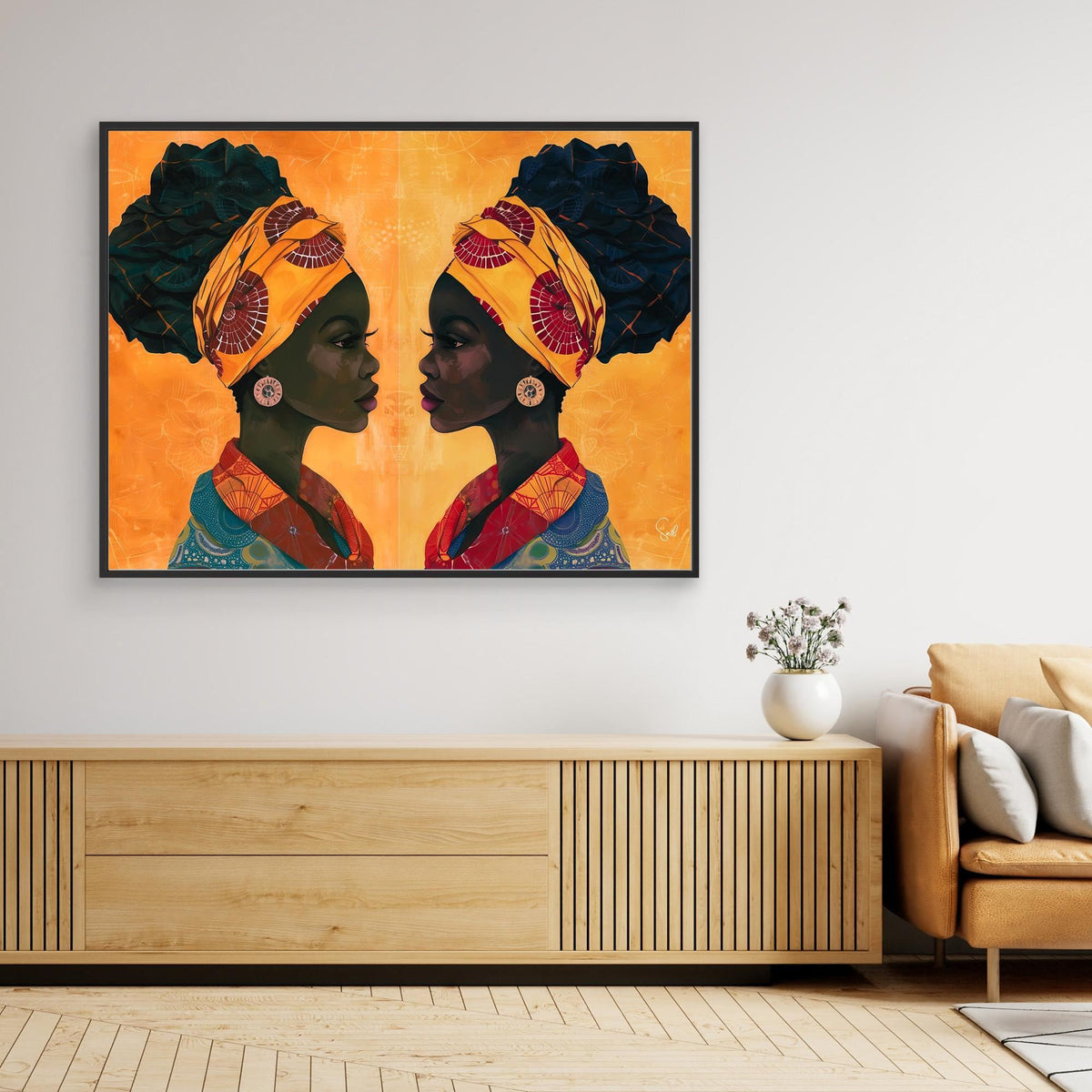 Sandy and Sangria African art canvas print with a dark oak frame on a living room wall