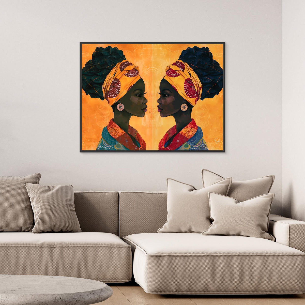Sandy and Sangria African art canvas print with a black frame above a sofa
